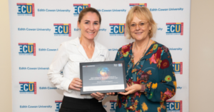 Dr Simone-Radavelli with Professor Caroline Finch holding media award certificate.